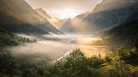Mountain landscape with fog in the morning. Panoramic view.