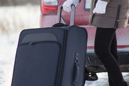 A person goes on a journey. By car in the winter.の写真素材