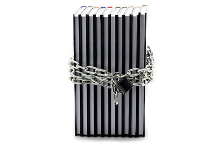 The book is wrapped in a chain with a lockの写真素材