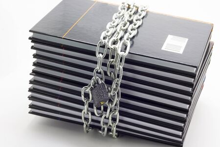 The book is wrapped in a chain with a lockの写真素材