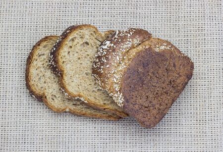 Sliced ??bread on burlap.の写真素材