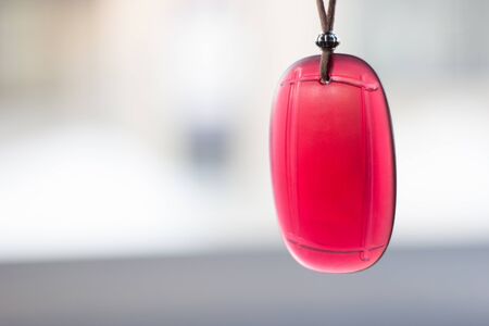 Air freshener hanging in the car on natural backgroundの写真素材