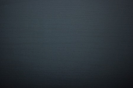 The dark texture of a wooden table
