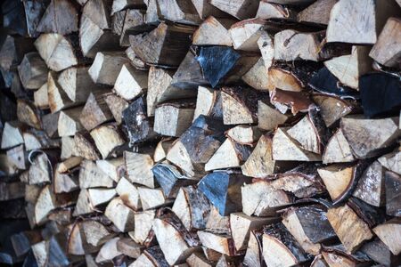 Firewood for the winter, stacks of firewood, pile of firewood.