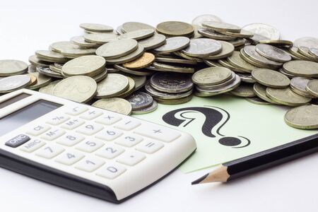 Money (coins), calculator and some stationery on white background, top view - financial background conceptの写真素材