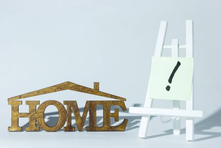 The word "house" is made of wood and an easel with symbolsの写真素材