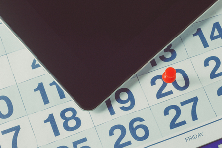 Wall calendar with pen and tabletの写真素材