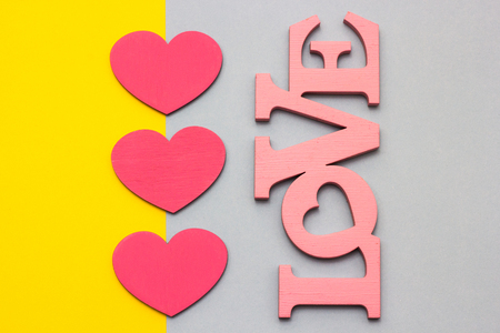 Wooden hearts on a multi-colored background, top viewの写真素材