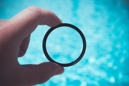 photo filter in the man's hands near the pool close-upの写真素材