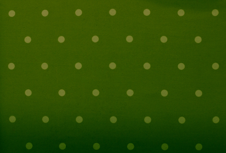 Green fabric and white tiny polka dots backgroundの写真素材