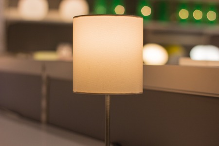 A beautiful lamp is on the table, the background is blurredの写真素材