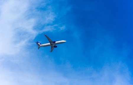 Antalya, Turkey -17 May 2018; International Antalya Airport passenger plane in blue sky. Antalya...