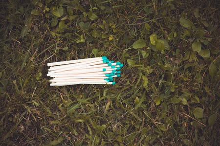 Matches on the grass, the concept of fire safety, toned photoの写真素材