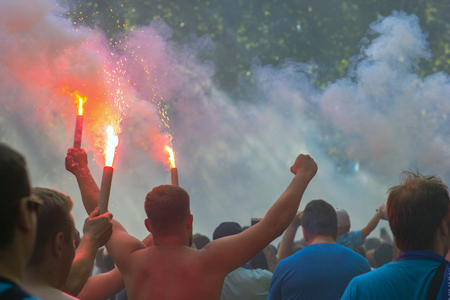 Football fans go to the stadium and burn the firecrackersの写真素材