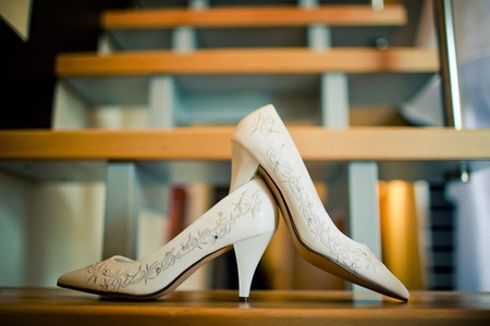 White bride shoes on the stairs, the background is blurredの写真素材