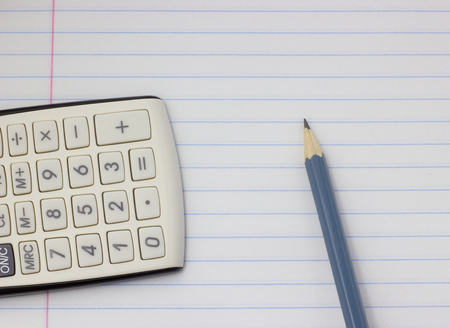 Gray pencil and calculator on white background, back to school, education conceptの写真素材