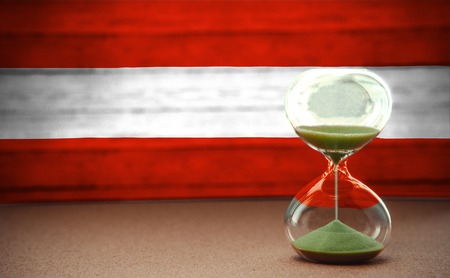 Hourglass on the background of the Austria flag, the concept of time and countries, space for text