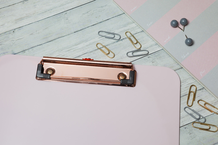 Home office workspace mockup, clipboard, notebook and accessories. Flat lay, top viewの写真素材