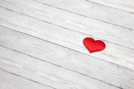 Red heart on wooden background, love concept, space for text.の写真素材