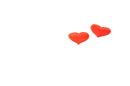 Two red hearts on an isolated white background. Valentine's Day, March 8, women's day conceptの写真素材