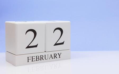 February 22st. Day 22 of month, daily calendar on white table with reflection, with light blue background. Winter time, empty space for textの写真素材
