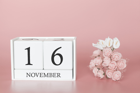 November 16th. Day 16 of month. Calendar cube on modern pink background, concept of bussines and an importent event.の写真素材