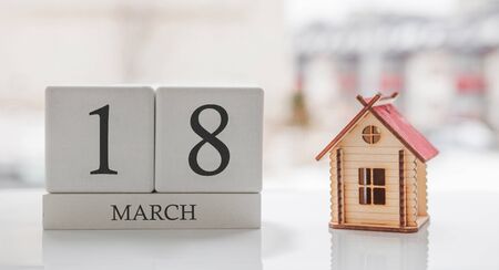 March calendar and toy home. Day 18 of month. ?ard message for print or rememberの写真素材