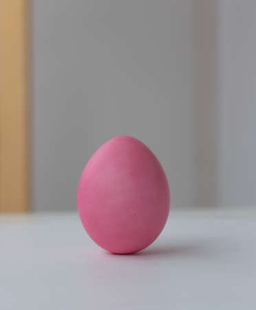 Easter holiday. Delicate eggs in pastel color on a blurred backgroundの写真素材