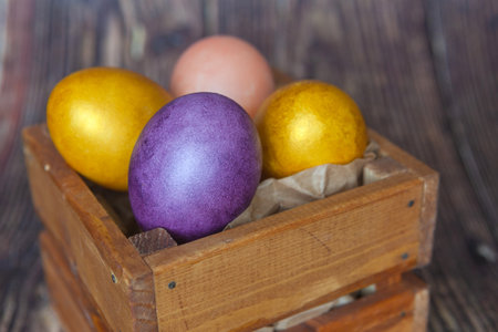 Colorful Easter eggs on dark wooden background. Easter holiday conceptの写真素材
