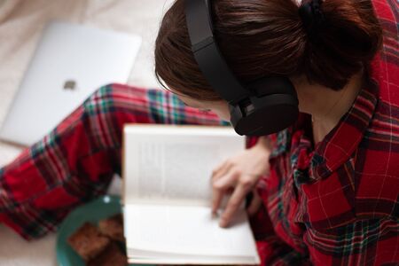 Woman With Headphones Reading Book Knowledge Relax Concept