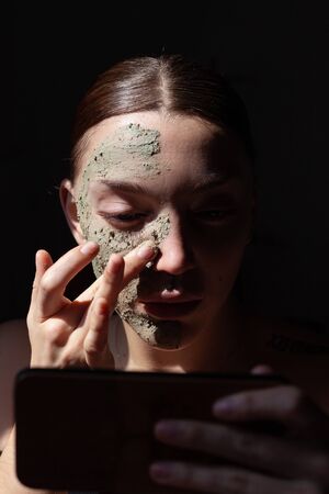 Organic cosmetic mask (scrub) with natural extracts in woman face