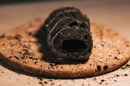 read with activated charcoal on wooden backgroundの写真素材