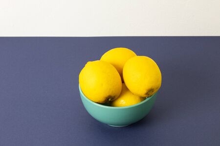 Plate with lemons on the tableの写真素材