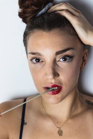 Portrait of girl playing with chewing gum