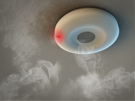 Smoke detector on ceiling detects smoke and give alarmの写真素材