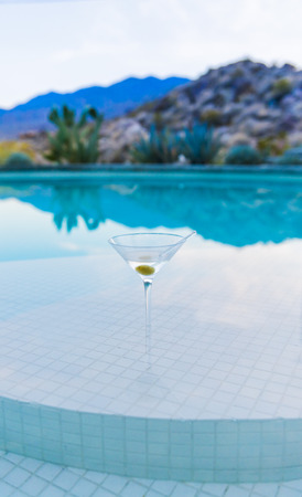Martini on Pool Bar With Mountains in Background.の写真素材