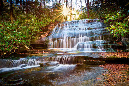 Sun setting over Grogan Creek Falls (or Falls on Grogan Creek) located in Pisgah National Forest...