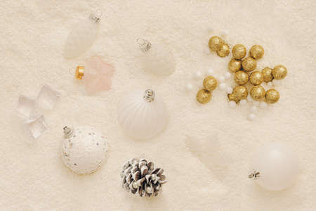 Pastel New Year's concept. Lots of puffy snow. Pastel color decorations. Christmas balls are milky...