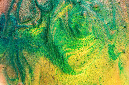 Abstract liquid. A simple and peaceful texture. A combination of green and yellow with shades of emerald green and beige.Texture of sand, soft particles. Texture that looks like the geographical areaの写真素材
