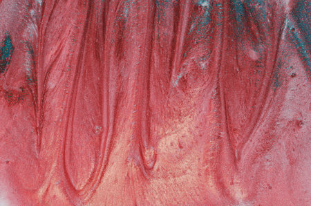 Abstract liquid texture. Pink flambe granular structure with hints of petrol blue. Hollows and bumps with a slight shine. Brush strokes. Beautiful grunge decorative wall background.の写真素材