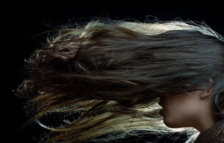 Studio shot of the woman with long hairsの写真素材