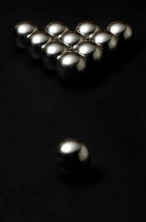 photo of metall balls on black trash billiard table surfaceの写真素材