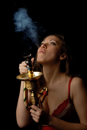 Photo of beautiful model getting a bang out of smoking kalian