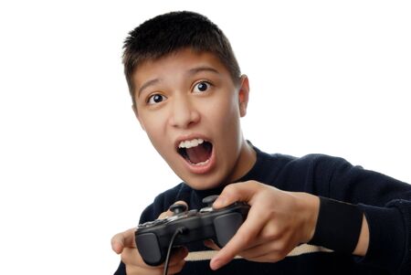 Photo of the boy plaiyng in computer hame with joystick