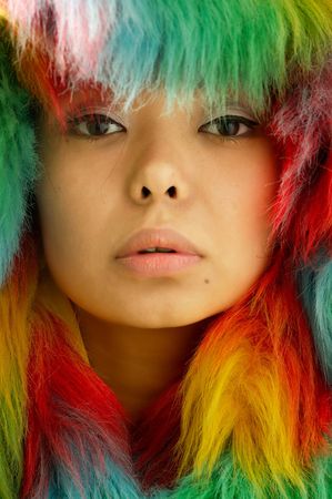 Photo portrait of the girl in colored fur coatの写真素材