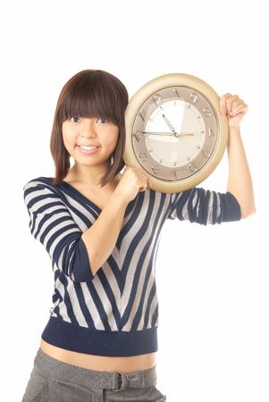 Photo of the smiling lady holding the clockの写真素材