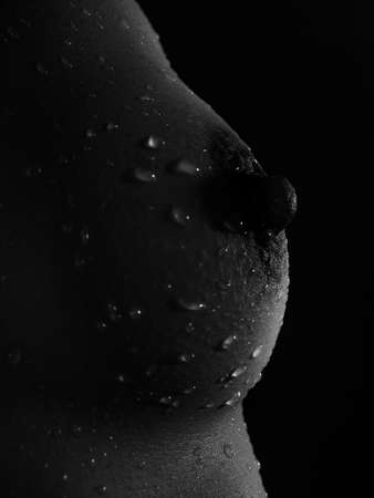 Close-up photo of the  breast with water dropsの写真素材