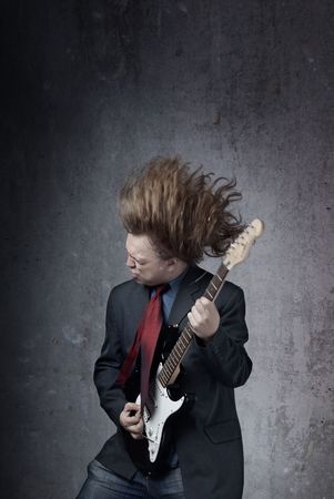 Emotional photo of the man playin on electric guitarの写真素材