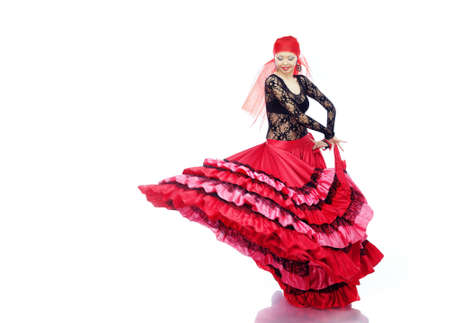 Smiling lady dancing Flamenco in traditional costumeの写真素材