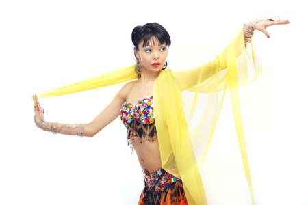 Asian lady dancing belly-dance with yellow fabricの写真素材